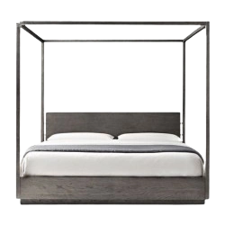Elegant wooden poster bed with intricate design details