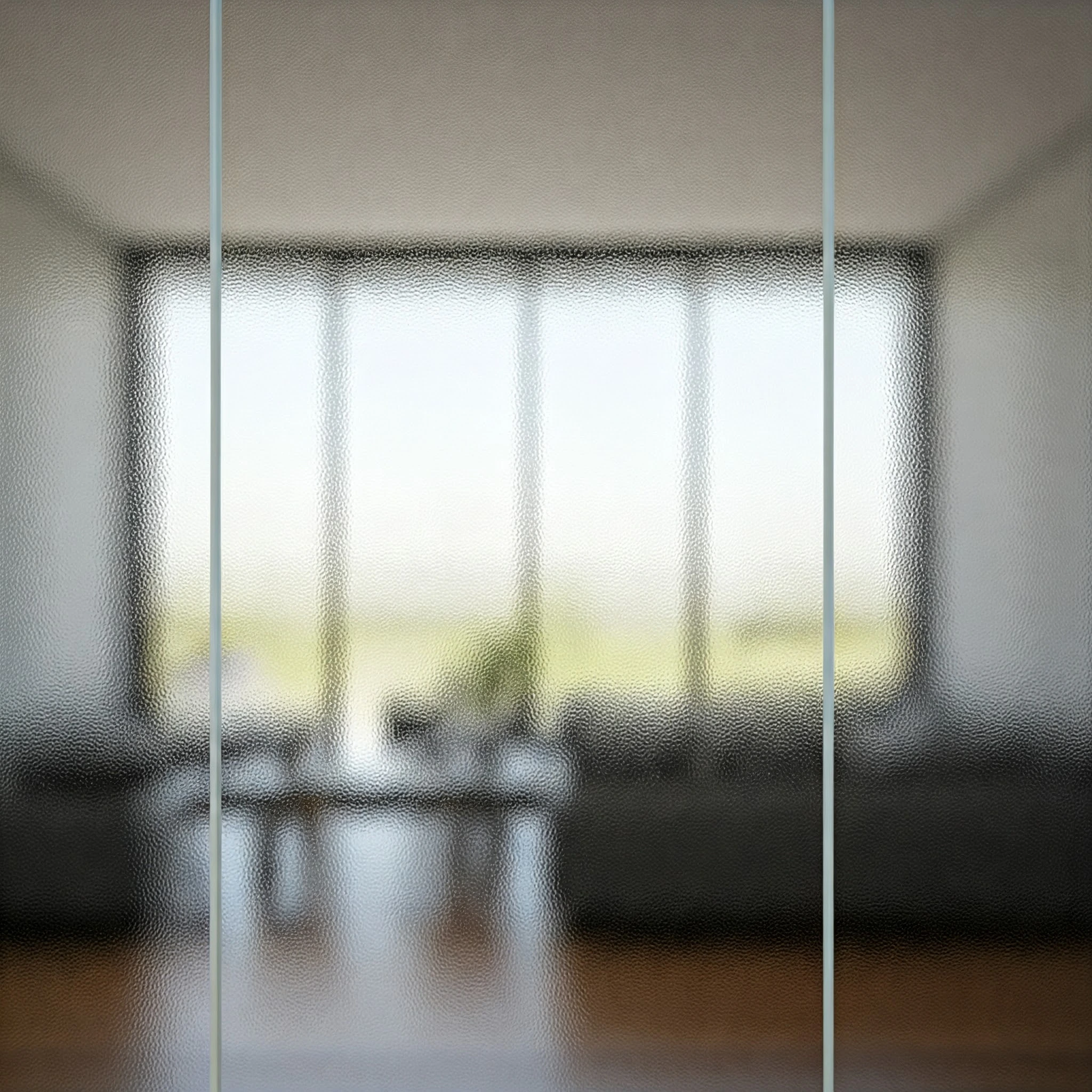 Clear glass wall partition in a modern office space